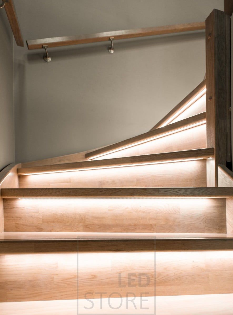 Indirect lighting with LED strip on stairs mounted on the staircase lip.